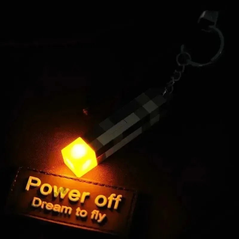 --2025 New World Torch Light Torch Can Shine Keychain Mini Model Pendant Toy Most Popular Festival Mode