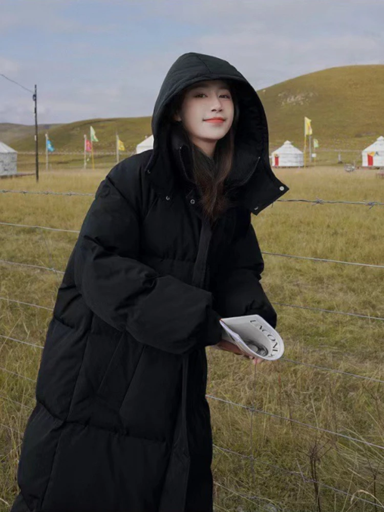 Longo engrossado para baixo algodão pão estilo casaco feminino inverno 2025 outerwear coreano solto longo na altura do joelho sólido jaqueta com capuz