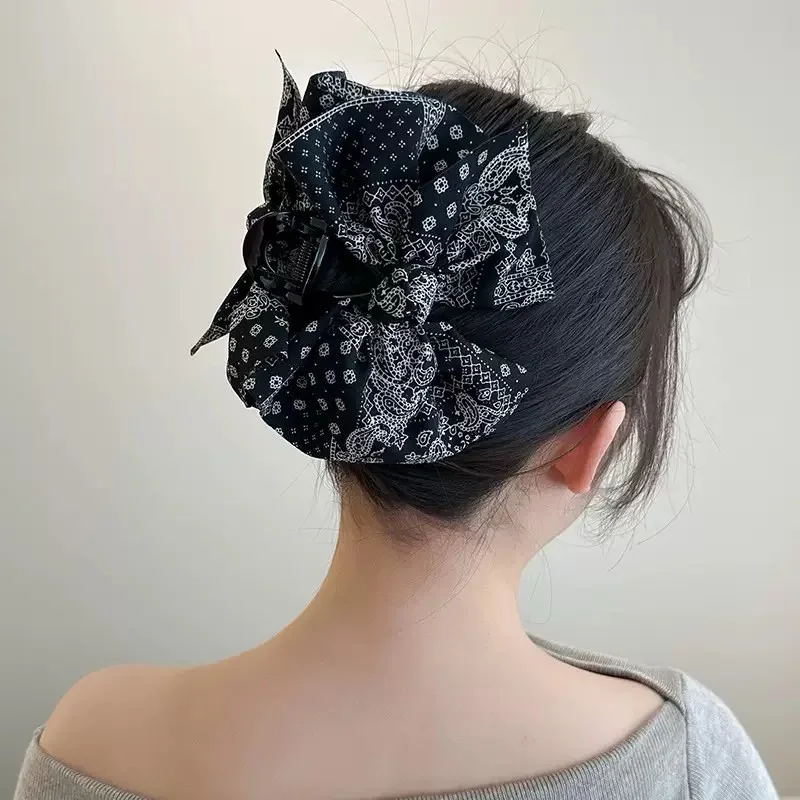 Accessori per capelli di fascia alta per donna con clip per fiocco su entrambi i lati in tessuto con stampa leopardata dal temperamento retrò
