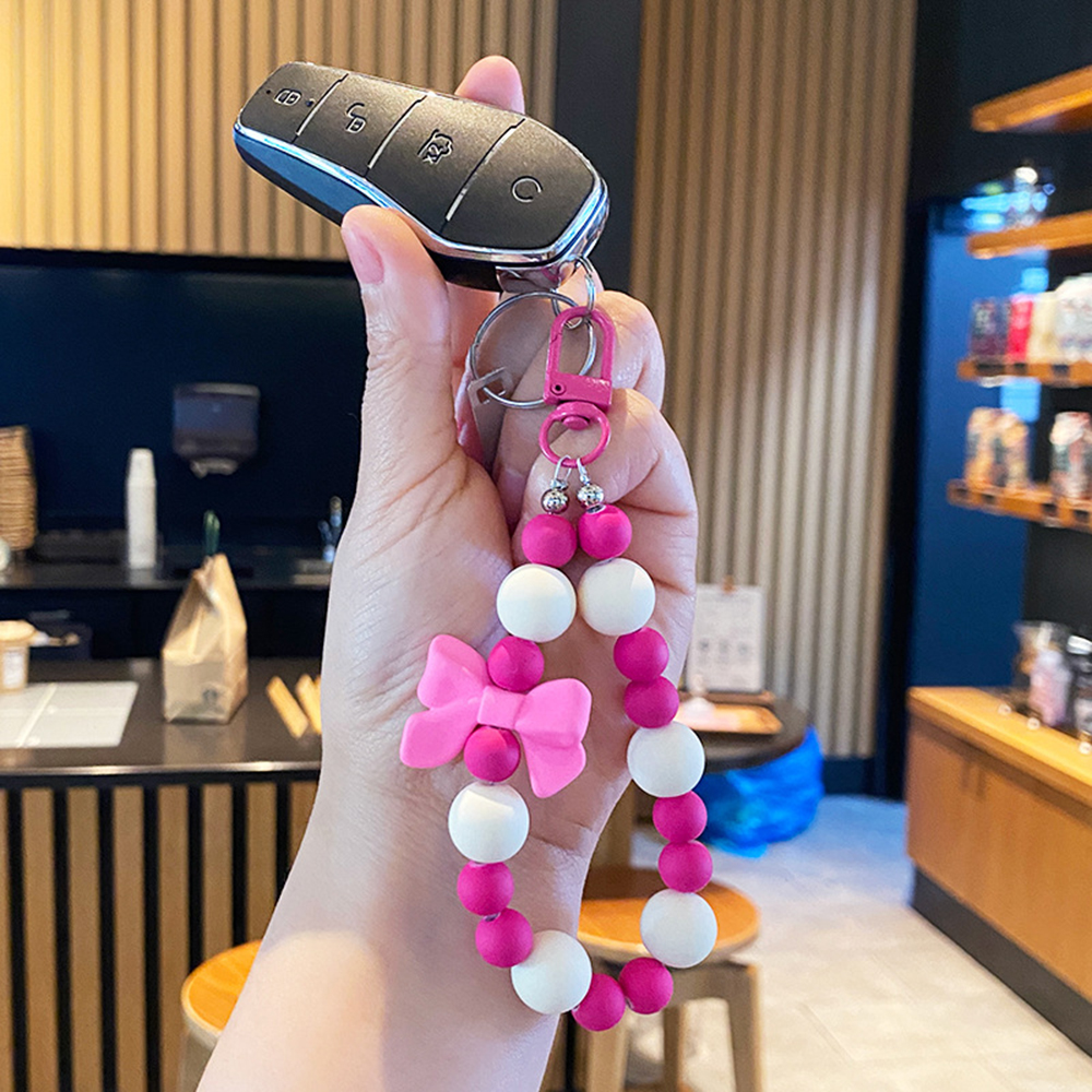 Llavero con lazo de perla rosa, cadena para teléfono móvil, bolsa para auriculares, cuerda antipérdida, llavero para coche, colgante con cuentas, acceso colgante para mochila