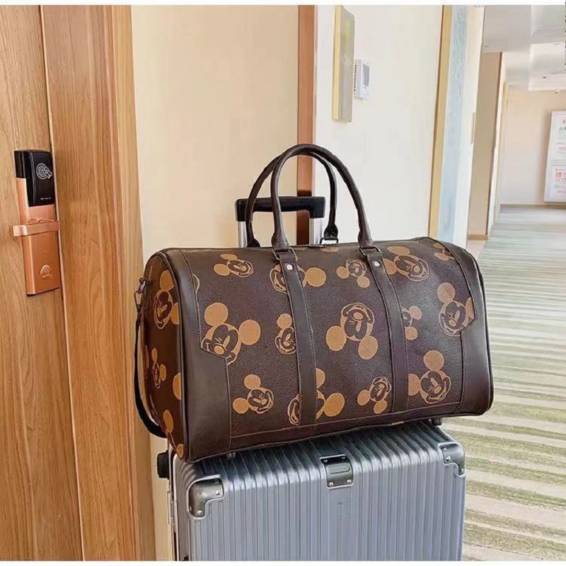 Disney mickey nova moda feminina bolsa de viagem bolsa de bagagem masculina e feminina grande capacidade bolsa mensageiro de um ombro