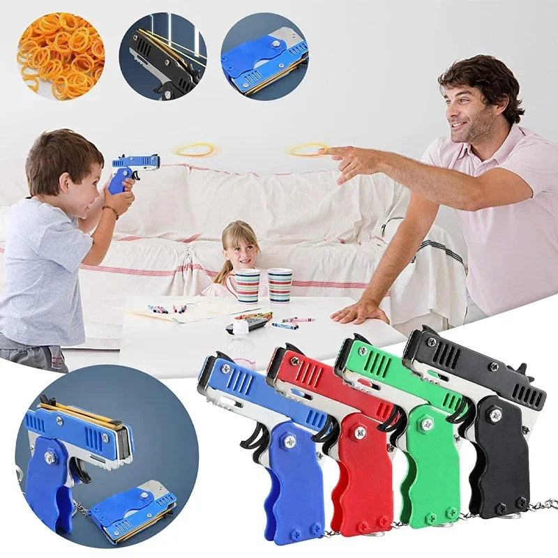 1PC Mini brelok do kluczy Pistolet z gumką Pistolet zabawkowy Pistolet strzelecki Stop Dziecko Zajęcia na świeżym powietrzu Gra imprezowa Prezent urodzinowy dla dzieci