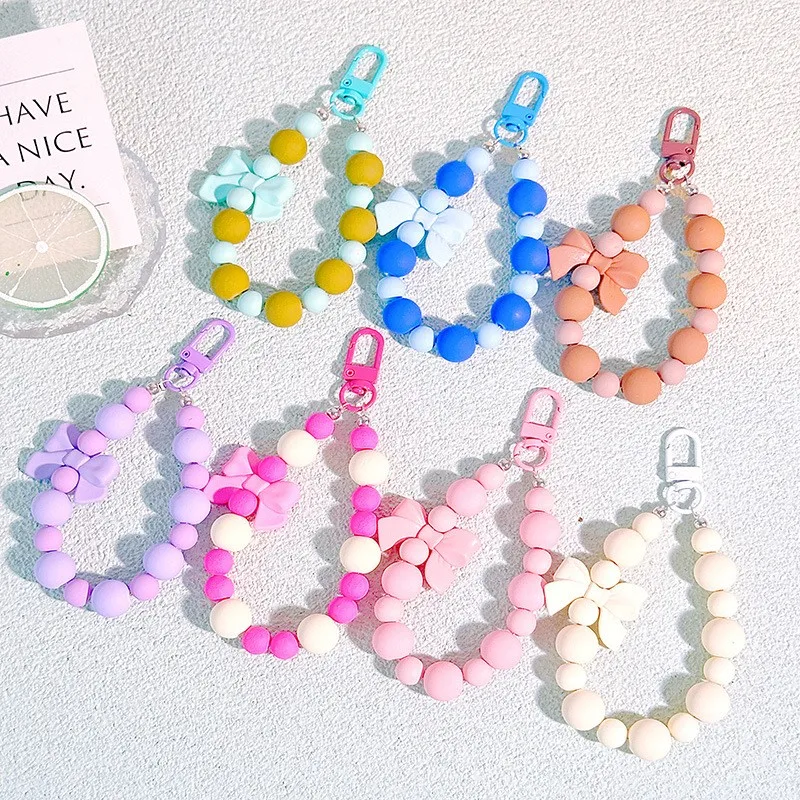 Portachiavi con fiocco di perle rosa, catena per cellulare, borsa per auricolari, corda anti-smarrimento, portachiavi per auto, ciondolo con perline, accesso al pendente dello zaino