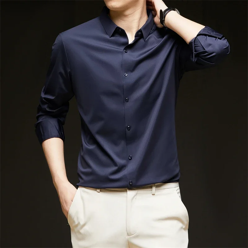 Nueva camisa informal de negocios de manga larga de Color sólido para hombre, resistente a las arrugas, cómoda, versátil para todas las estaciones