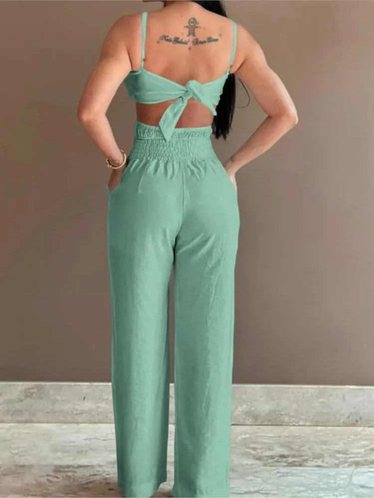 ฤดูร้อนสปาเก็ตตี้แฟชั่นJumpsuitผู้หญิงใหม่ดอกไม้รูปแบบShirred Hollow Out Casualไม่สมมาตรคอBackless Jumpsuits