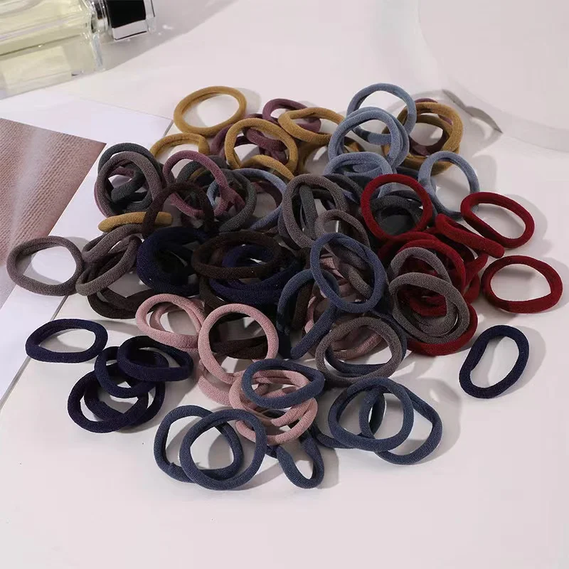 Muitas pessoas como a corda de cabelo de alta elasticidade 100 peças de várias cores corda de anel de cabelo sem costura.
