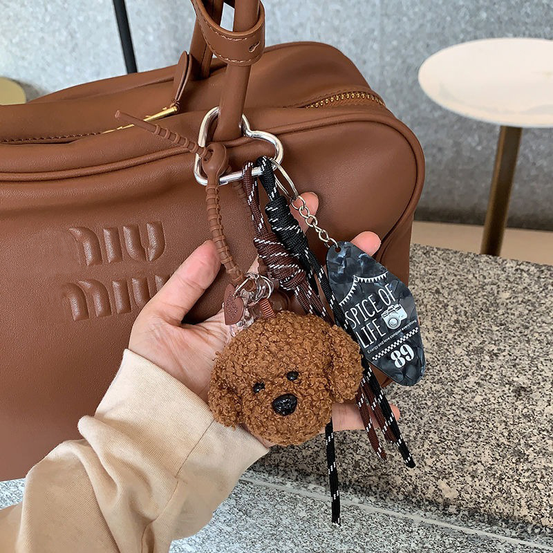 Lindo oso de peluche colgante Miu cuerda de escalada de viento cuerda de mano muñeca de dibujos animados bolsa colgante decoración llavero de coche de moda