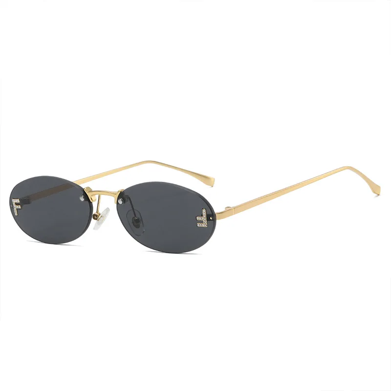 Moda sem aro óculos de sol feminino uv400 oval elegante diamante f óculos de sol retro