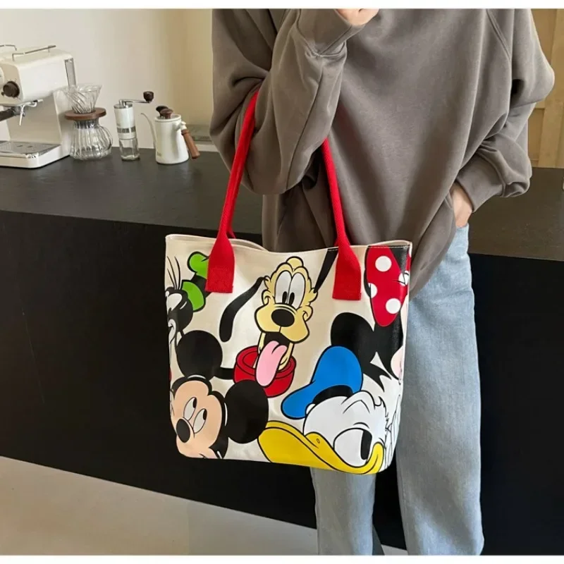 Bolso de lona versátil de gran capacidad con dibujos de Mickey para mujer, bolso de mano informal y versátil, bolso de clase para estudiantes