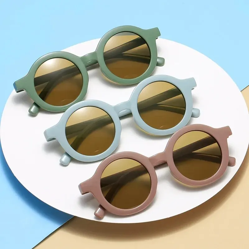 Gafas de sol con montura redonda para bebé, lentes de Color caramelo, protección UV de Color sólido, redondas y cómodas, estilo Retro, novedad