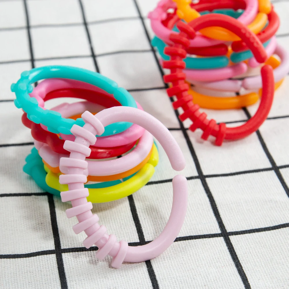 8pcs Baby Teether Rattles ของเล่น Chew ของเล่นสําหรับทารกแรกเกิดยางสายรุ้งแหวนความปลอดภัยของเล่นเด็กเปลรถเข็นเด็กแขวน