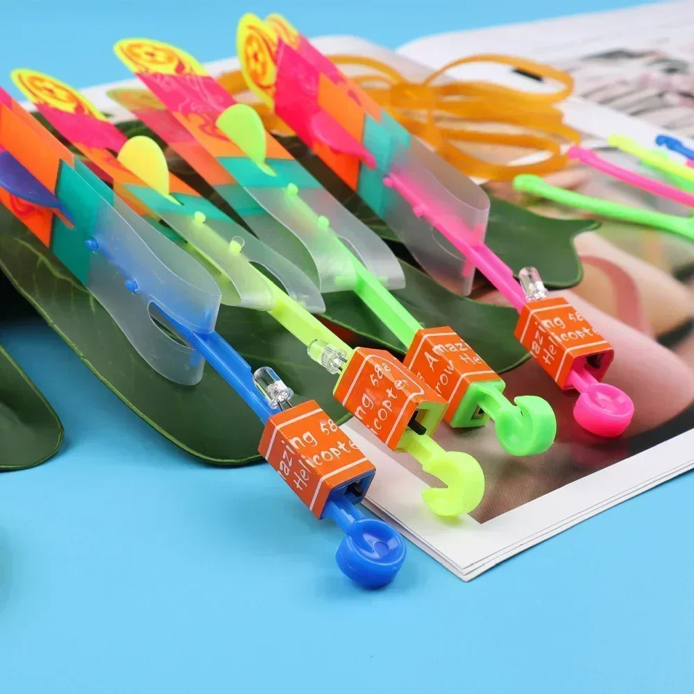 Brinquedos de luz luminosa colorida crianças borracha banda catapulta seta foguete jogos led iluminação elástica rapidamente voando rápido