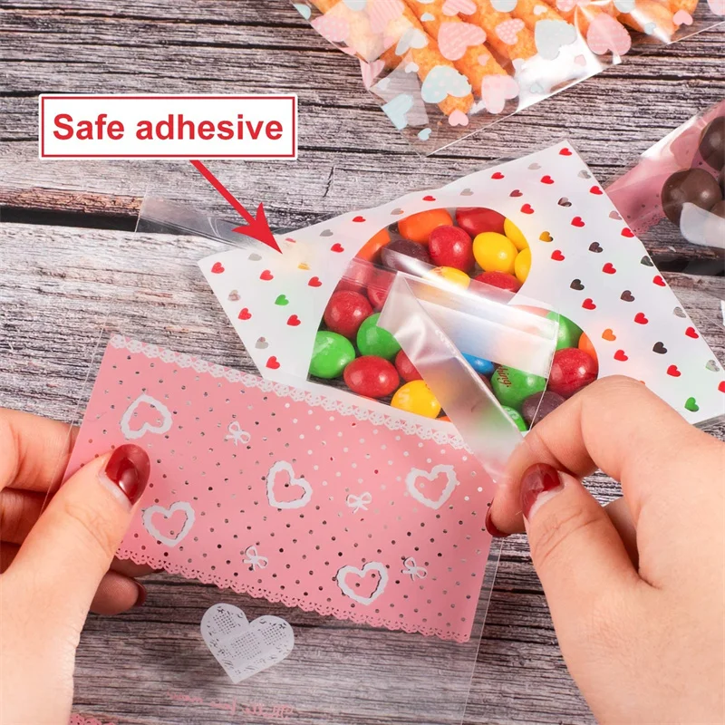 100pcs 7x7/10x10 ซม.หัวใจพลาสติก CELLO กระเป๋าปิดผนึกด้วยตนเองสําหรับ DIY คุกกี้ขนมขบเคี้ยวแพคเกจตกแต่งขนาดเล็กธุรกิจ