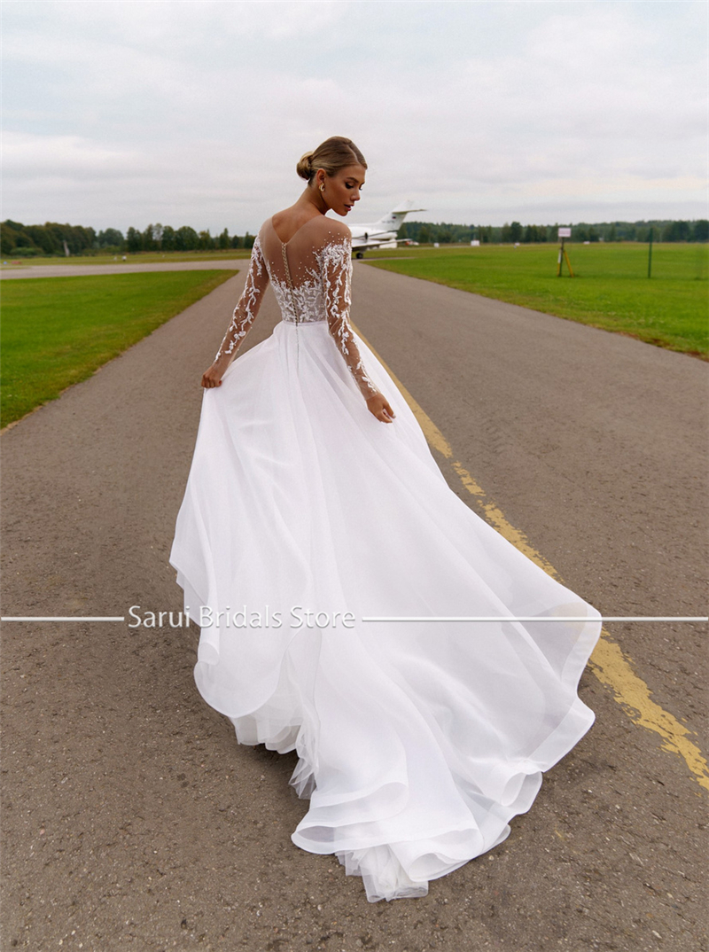 Maßgeschneidertes, transparentes Ausschnittkleid mit schweren Kristallen, langen Ärmeln, weißes Hochzeitskleid aus Organza und Tüll, A-Linie, glitzerndes Brautkleid