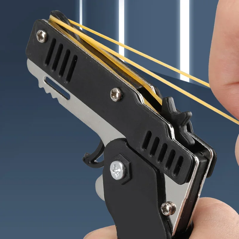 1PC Mini brelok do kluczy Pistolet z gumką Pistolet zabawkowy Pistolet strzelecki Stop Dziecko Zajęcia na świeżym powietrzu Gra imprezowa Prezent urodzinowy dla dzieci