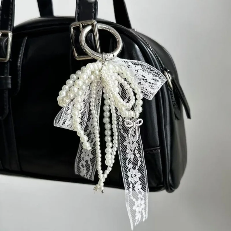 LLavero con lazo de encaje de perlas de imitación, llavero con colgante de cuentas dulces para mujer, bolso y mochila, llavero, adorno exquisito