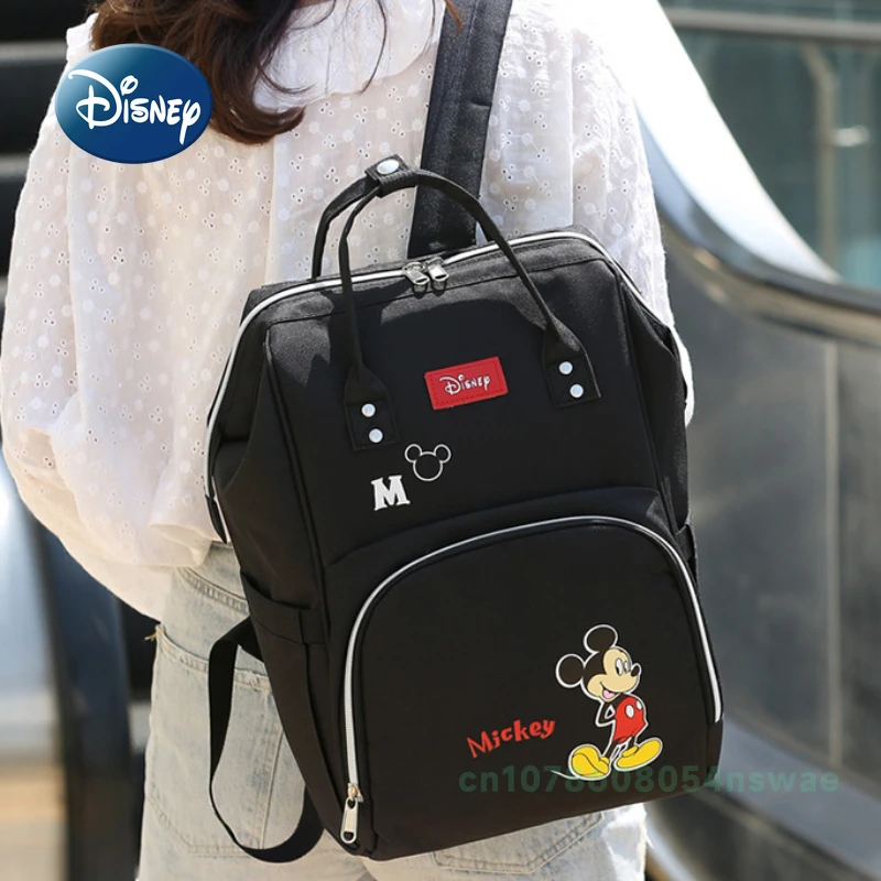 Disney's New กระเป๋าผ้าอ้อมกระเป๋าเป้สะพายหลังแบรนด์หรูกระเป๋าแฟชั่นเด็กการ์ตูนน่ารักกระเป๋าผ้าอ้อมเด็กขนาดใหญ่ความจุ Multi Function