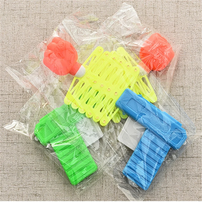 Retractable Fist Shooter Trick ปืนของเล่นตลกเด็กพลาสติกปาร์ตี้เทศกาลของขวัญสนุกคลาสสิก Elastic Telescopic Fist ของเล่น