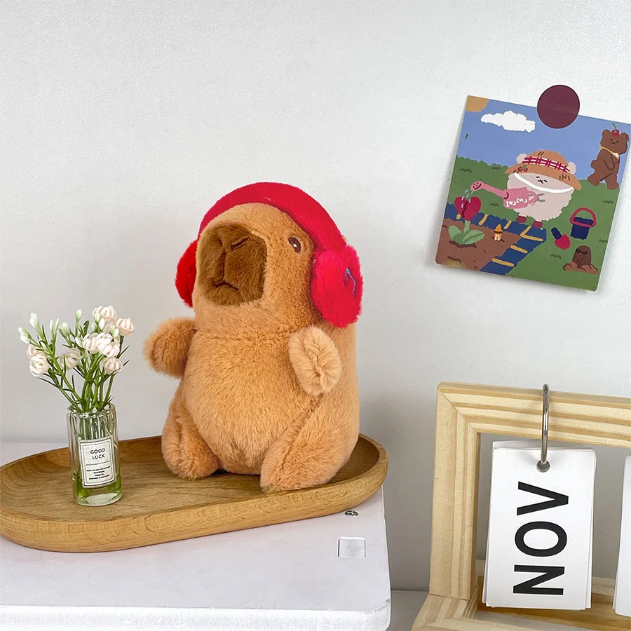 Lindo capibara con auriculares juguete para niños cubierta para la cabeza muñeca capuibala llavero colgante suave muñeco de peluche pareja llavero regalo