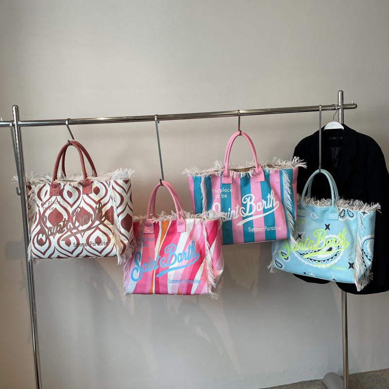 Bolso de mano de playa de gran capacidad con borlas a la moda, nuevo bolso de mujer de un solo hombro con letras con estampado de leopardo