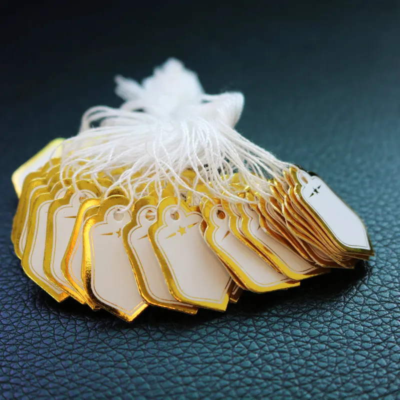 เครื่องประดับป้ายนามบัตร 100 ชิ้น/ล็อตราคา DIY Tie String เครื่องประดับป้าย Gold และ Silver แท็กขนาดเล็ก