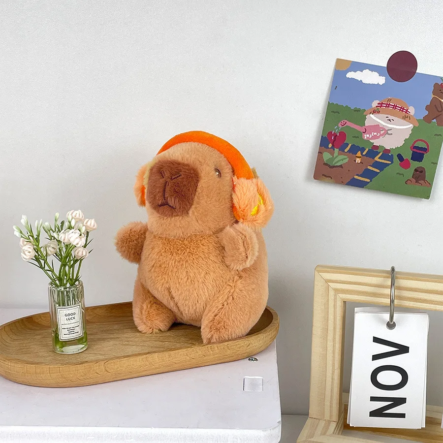 Lindo capibara con auriculares juguete para niños cubierta para la cabeza muñeca capuibala llavero colgante suave muñeco de peluche pareja llavero regalo