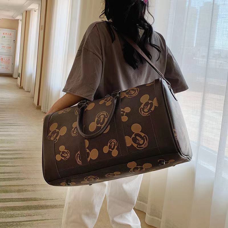 Disney mickey nova moda feminina bolsa de viagem bolsa de bagagem masculina e feminina grande capacidade bolsa mensageiro de um ombro