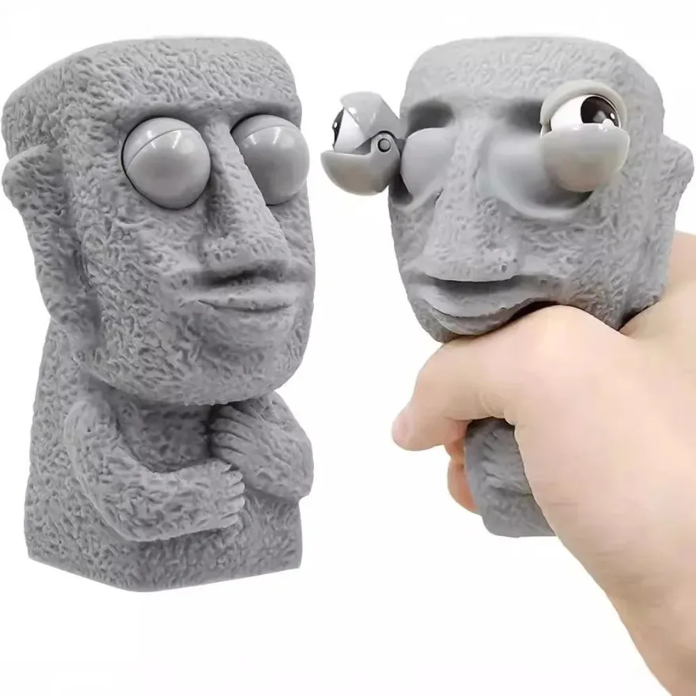 Stone Man lancia el juguete antiestrés rebota lentamente estatua Moai suave exprimir los ojos interesados expresión relaja el estrés regalo para niños