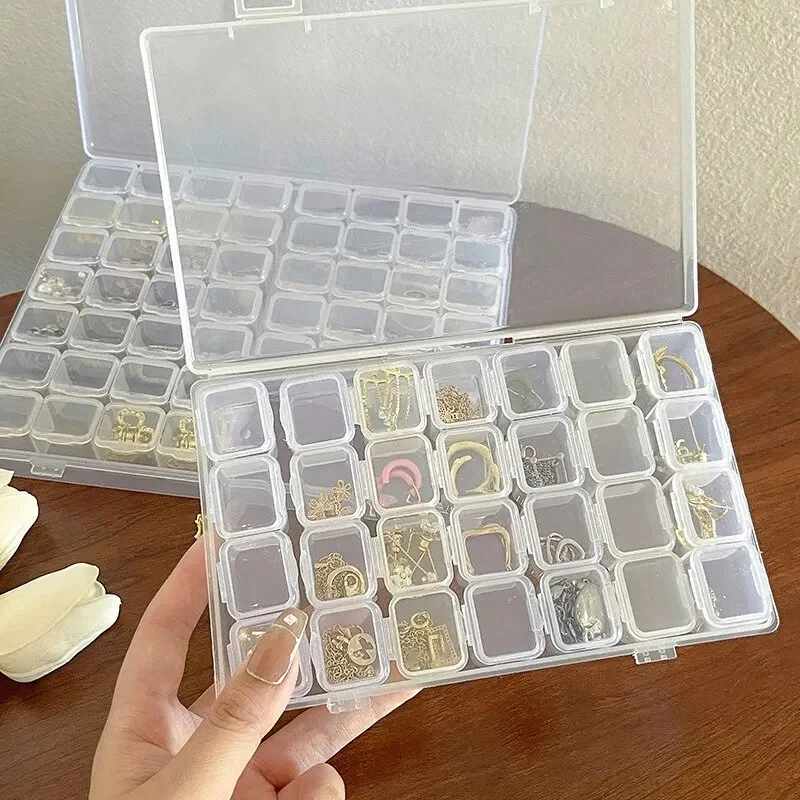 28-Gitter-Schmuck-Aufbewahrungsbox aus Kunststoff für Halsketten, Ohrringe, Ringe, Schmuckverpackungen, Organizer, tragbare Aufbewahrungsbox für Pillen und Medikamente
