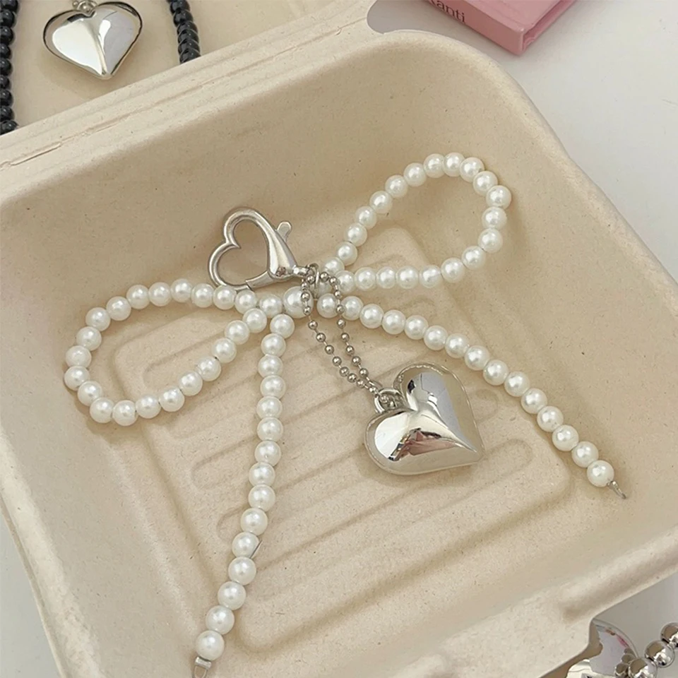 ZAKOL Weiß Bowknot Herz Schlüsselbund Frauen Süße Charme Perle Bogen Rucksack Schlüssel Ring Handgemachten Schmuck Ornament Taschen Anhänger Gif