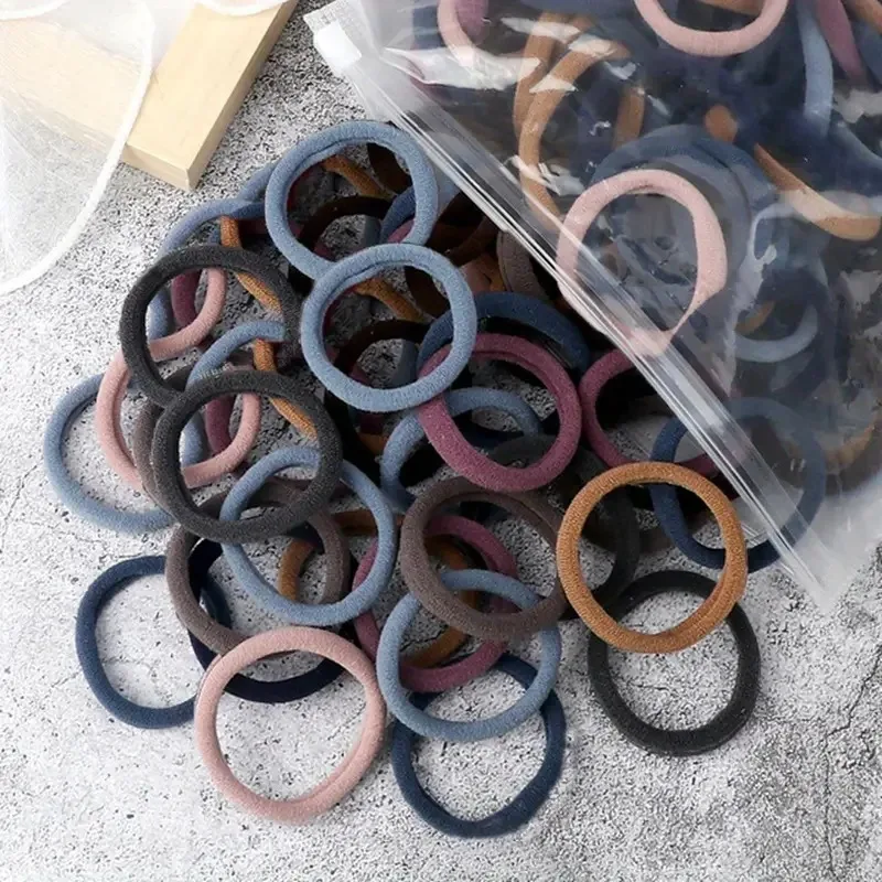 Muitas pessoas como a corda de cabelo de alta elasticidade 100 peças de várias cores corda de anel de cabelo sem costura.