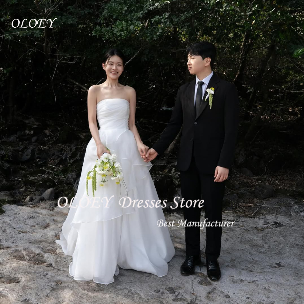 OLOEY Trägerlose koreanische Prinzessinnen-Hochzeitskleider то Sezonu Organza Elfenbein ärmellos gerüscht Maßgeschneiderte hübsche Brautkleider in Übergröße
