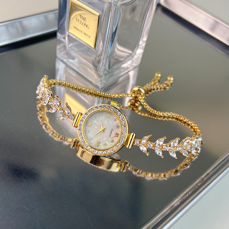 Reloj UTHAI para mujer, cadena de sirena, pulsera de ajuste libre de diamantes de lujo ligera, relojes de cuarzo de moda para mujer Beimu dorados