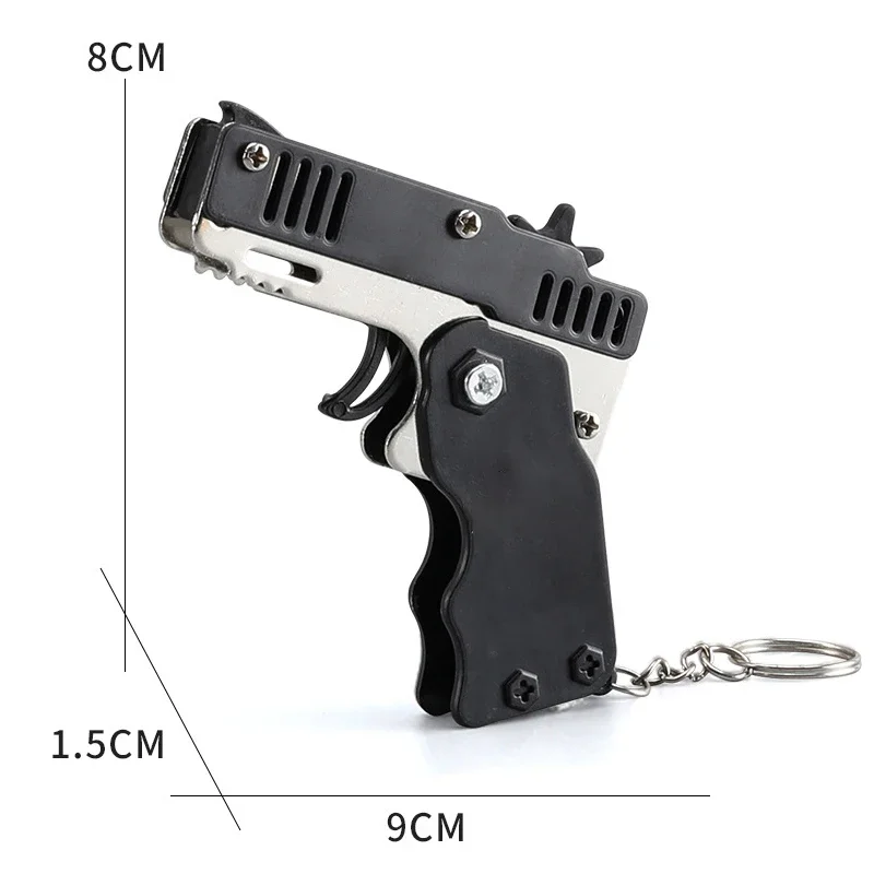1PC Mini brelok do kluczy Pistolet z gumką Pistolet zabawkowy Pistolet strzelecki Stop Dziecko Zajęcia na świeżym powietrzu Gra imprezowa Prezent urodzinowy dla dzieci