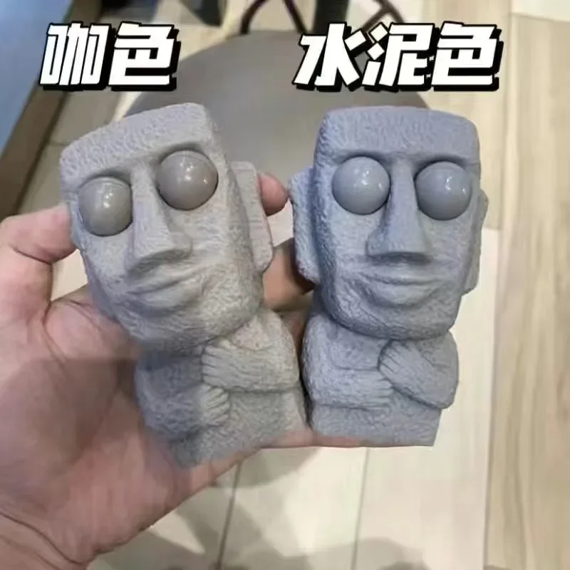 Homem de pedra lança brinquedo de estresse rebota lentamente estátua Moai macia espremer olhos interessados expressão relaxa o estresse presente das crianças