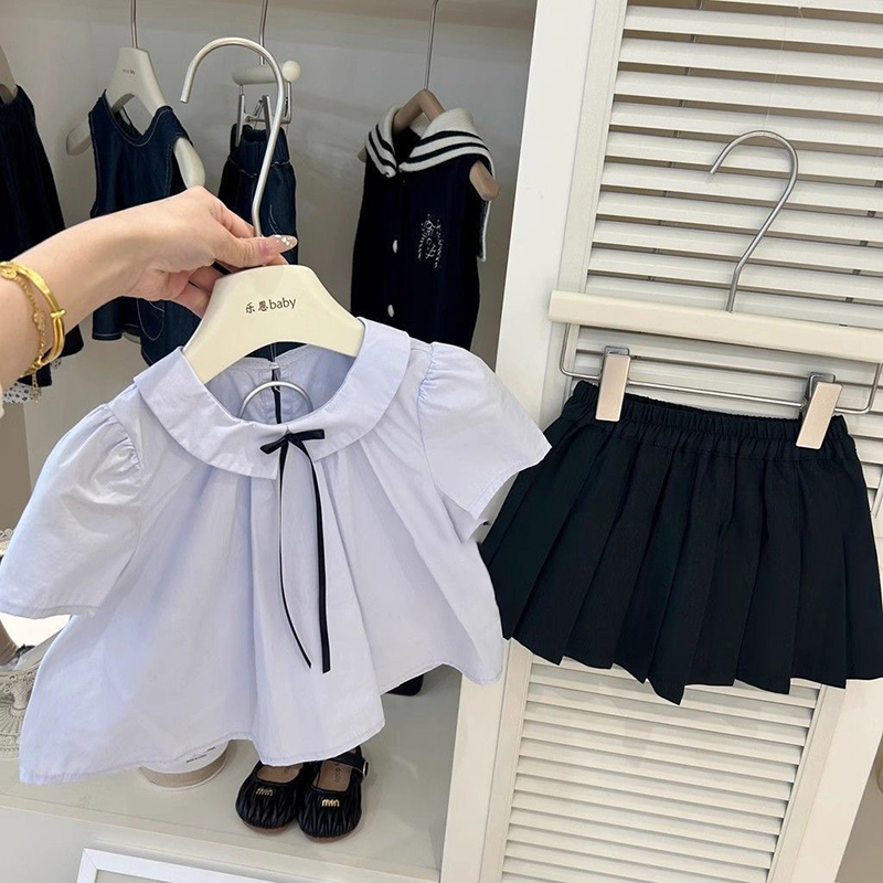 2025 Conjunto de falda plisada de Color sólido de estilo universitario para niñas de primavera y verano, camisa de manga corta de verano, conjunto de dos piezas con estilo