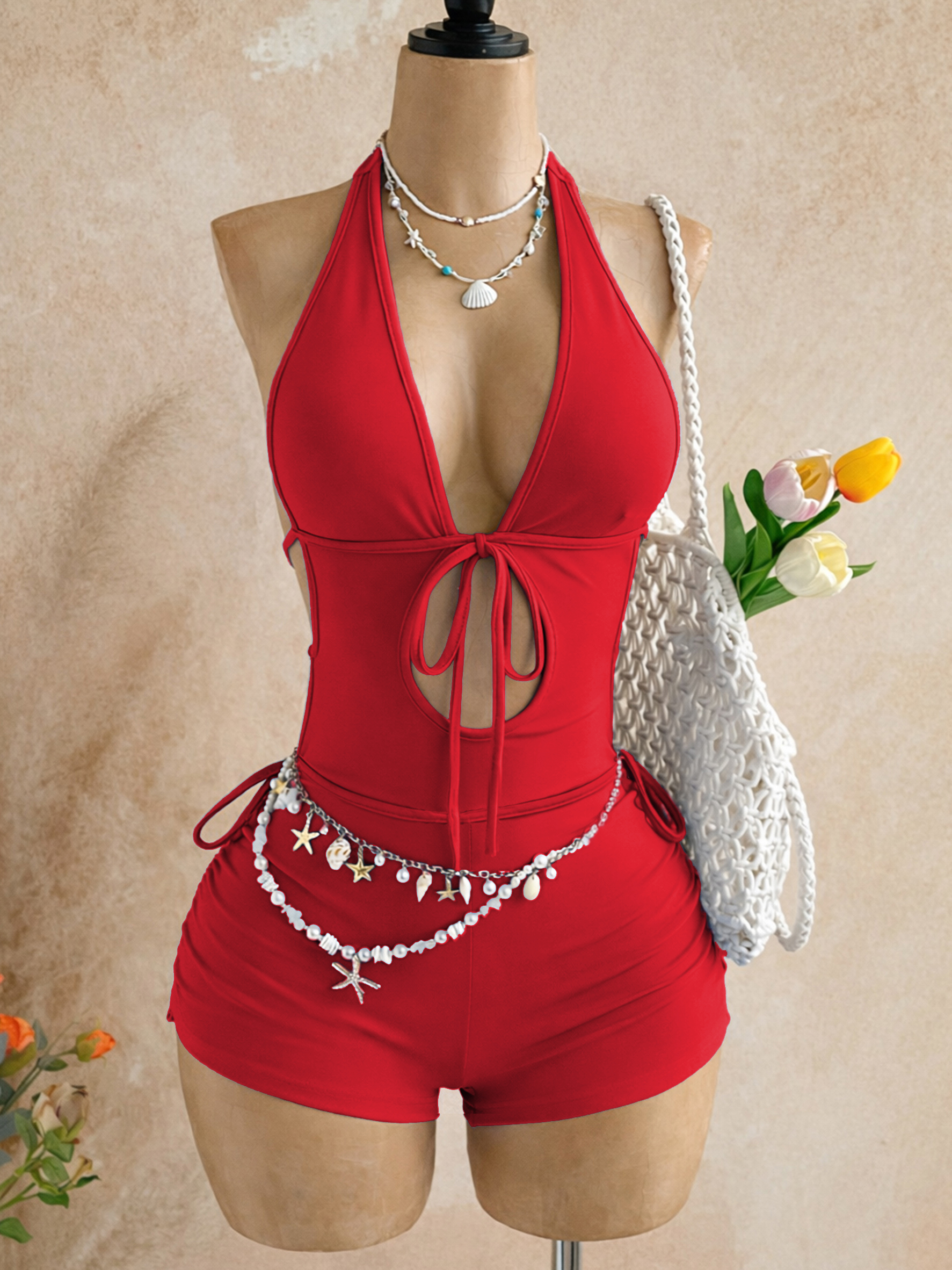 Amerikaanse stijl Spicy Girl rode jumpsuit uit één stuk, halterhals, diepe V, rugloos, strikceintuur, afslankend, korte jumpsuit voor strandvakantie