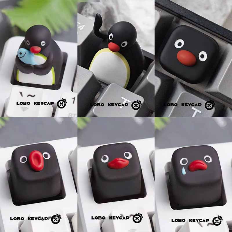 Zabawna seria Pingu, wiele wyrazów twarzy, uroczy styl pingwina, mechaniczna klawiatura, wymienne nakładki na klawisze, materiał żywiczny, Esc, gadżety, prezenty.