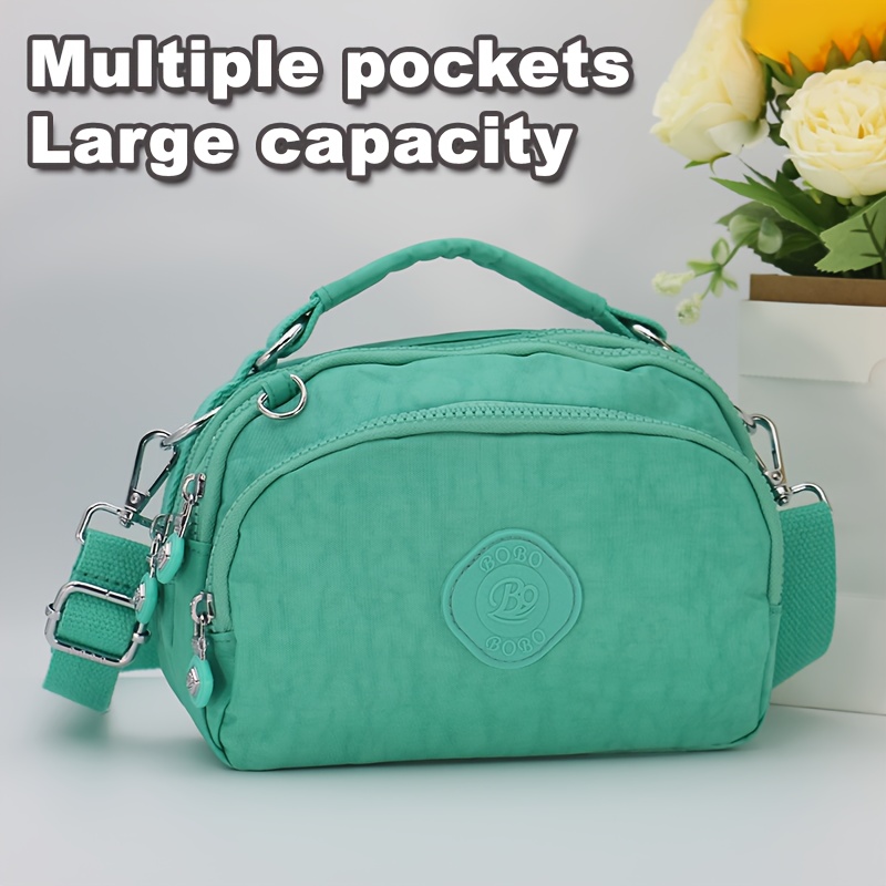 Bolsa crossbody feminina de nylon com vários bolsos, bolsa elegante para mensagens com alça de ombro removível.