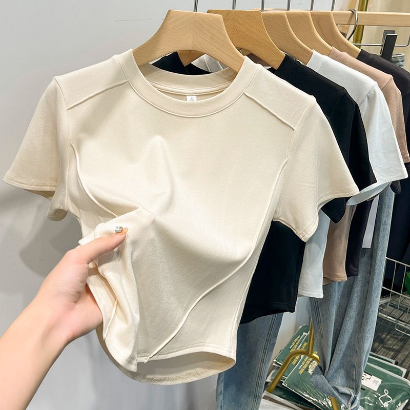 เสื้อยืดสีขาวฤดูร้อนปี 2026 ผ้าฝ้าย แขนสั้น สำหรับผู้หญิง นักเรียน สไตล์อเนกประสงค์ ทรงเข้ารูป เสื้อยืดฮาราจูกุ ครอปท็อป แฟชั่น