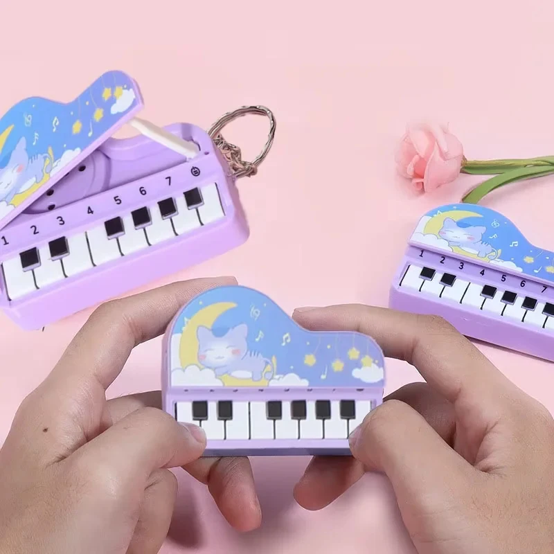 "A cute, miniature desktop piano keychain that doubles as a colorful music game machine. It's a fun educational toy and an ideal