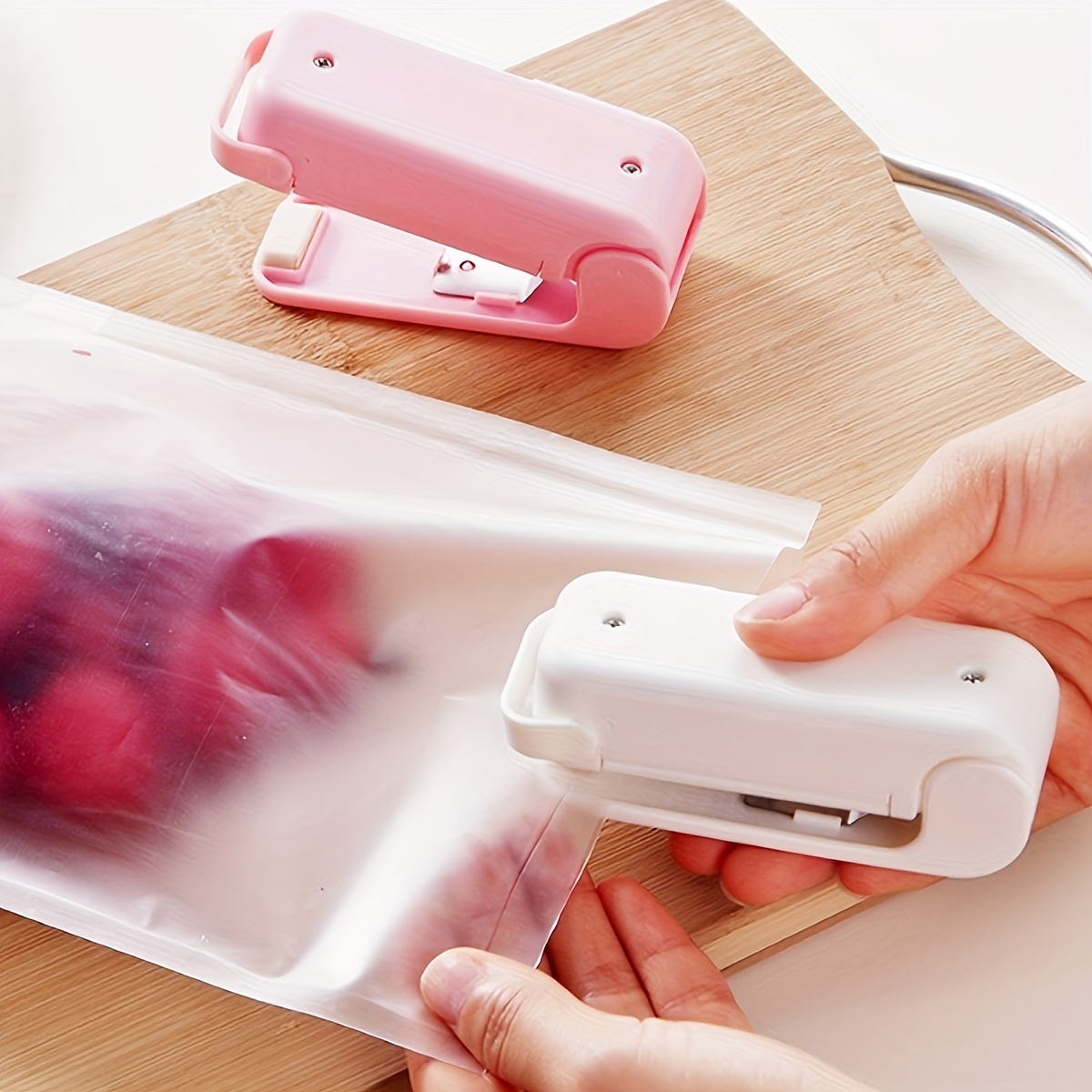 Mini-Versiegelungsmaschine, kleine Haushalts-Kunststoff-Versiegelungsmaschine, Snacks, feuchtigkeitsbeständiges Versiegelungsartefakt, tragbarer Druck aus Kunststoff