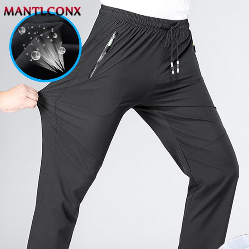 Pantaloni casual da uomo traspiranti Pantaloni sportivi da jogging in vita elastica dritta ad asciugatura rapida Pantaloni sportivi classici coreani Taglie forti 4XL 5XL