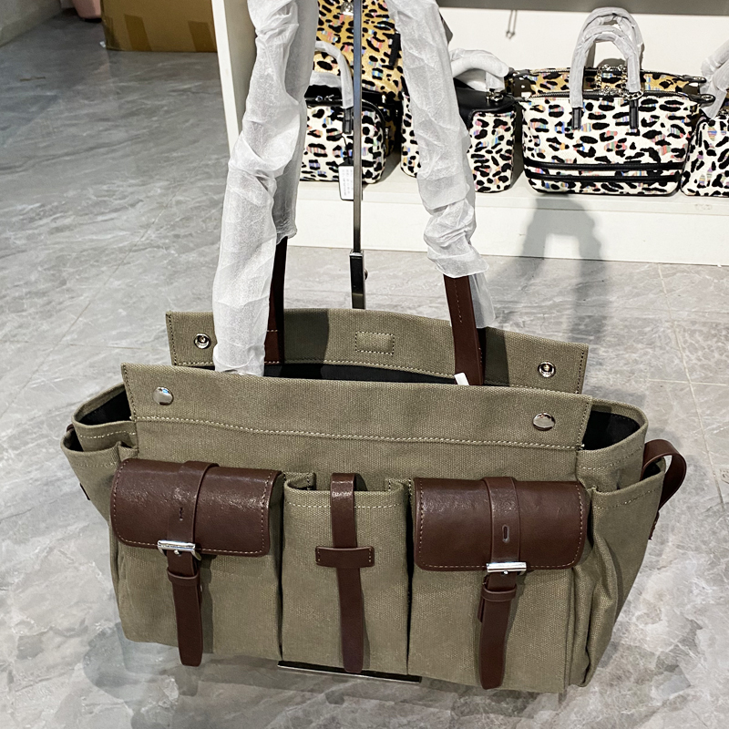 Bolsos de mano de lona clásicos para mujeres Bolsos y monederos de diseñador de lujo 2026 Nuevo en múltiples bolsillos Bolso de hombro de tela con asa superior