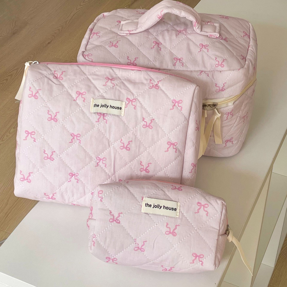Bolsa de cosméticos acolchada con lazo rosa para mujer, organizador de viaje de maquillaje con cremallera portátil, bolso de mano para mujer, bolsa de aseo para niña 2024
