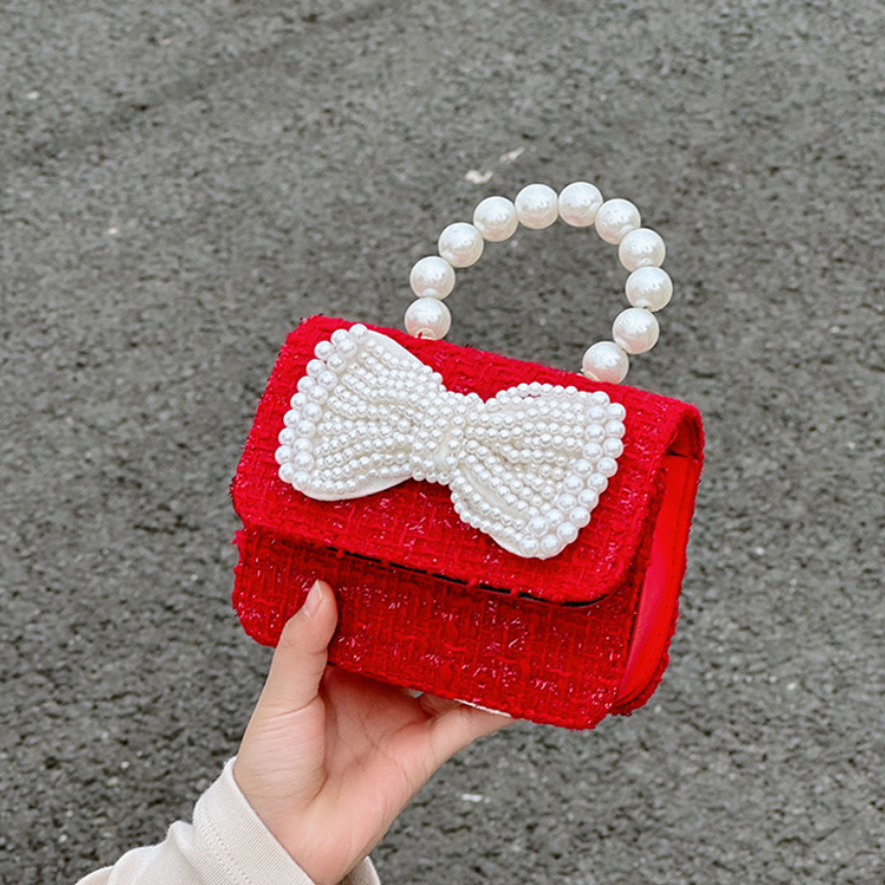 Mini bolso de hombro cuadrado de diseño a la moda para niños, agradable arco, flor, bolsos de mensajero para niña, mango de perla de lujo, monedero para cambio de chico