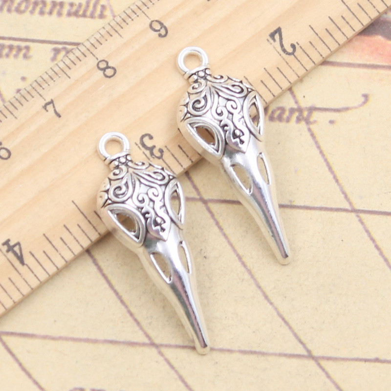 10 pezzi Charms teschio becco scheletro uccello 35x13mm ciondoli Color argento tibetano gioielli antichi che fanno artigianato fatto a mano fai da te