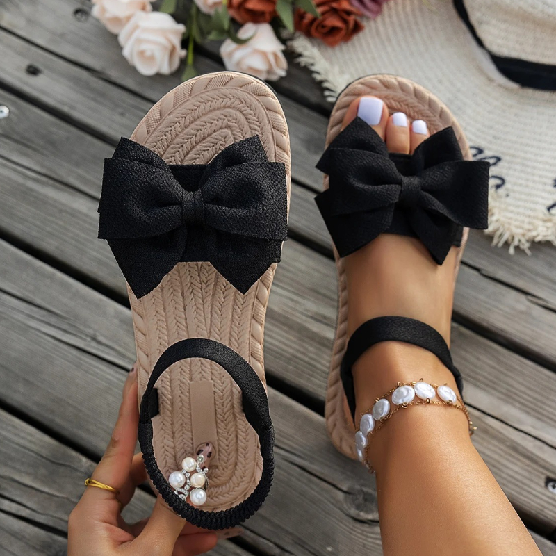 Nuovi sandali piatti estivi Pantofole da spiaggia alla moda Scarpe basse con papillon da esterno Sandali di tendenza antiscivolo da donna per la casa Sandali leggeri