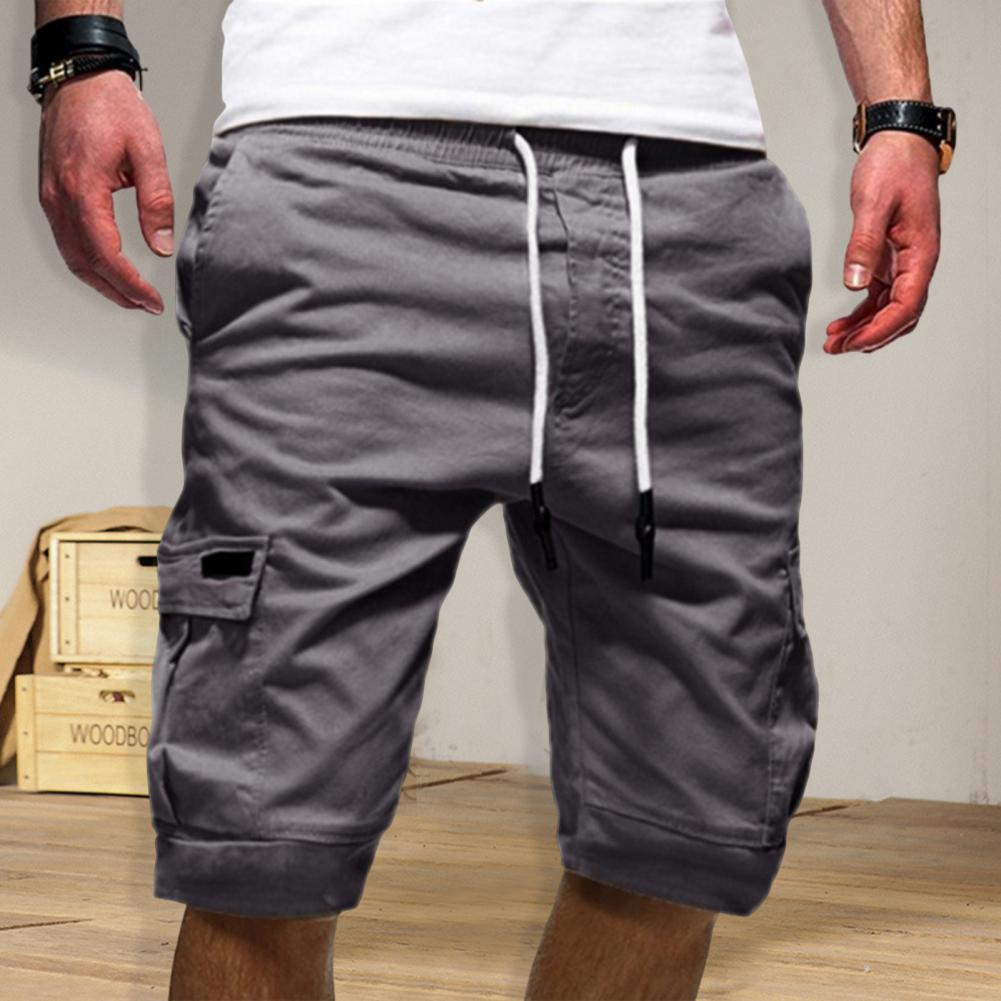 Heren werkbroekshorts met elastische tailleband, effen kleur, losse pasvorm en meerdere zakken, streetwear 2026
