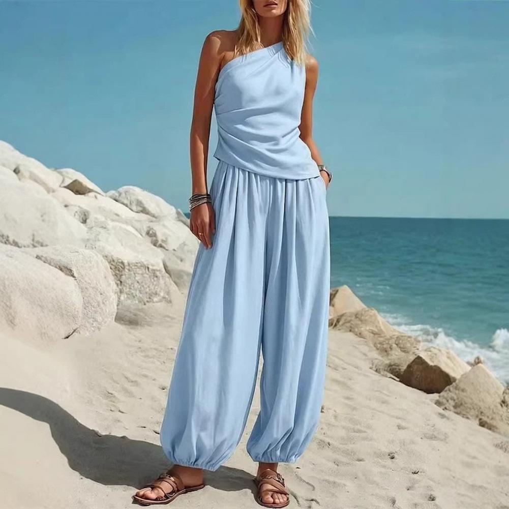 Completo due pezzi estivo da donna con top monospalla senza maniche e pantaloni